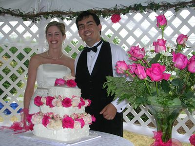 The bride and groom with the cake.
